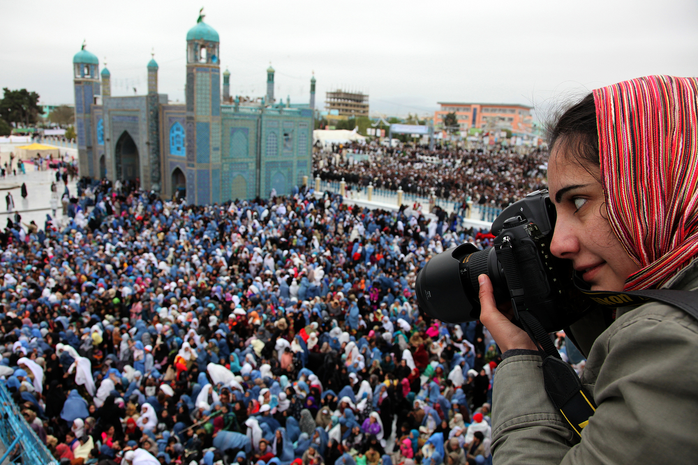 Farzana Wahidy, one of Afghanistan’s few women photographers, shoots New Year's celebrations at the magnificent Blue Mosque in Mazar-i-Sharif, in Afghanistan's north. Photo: Fardin Waezi / UNAMA