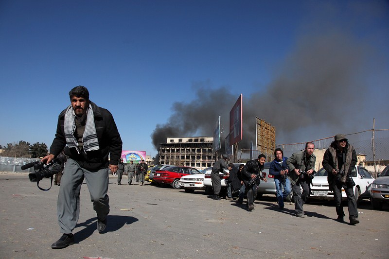 Afghan Journalists in the scene of an armed attack in the capital, Kabul, in 18 January 2010. Taliban militants struck the heart of the Afghan government in Kabul, prompting fierce gun battles after a suicide bomber blew himself up near the presidential palace. Photo: Fardin Waezi / UNAMA
