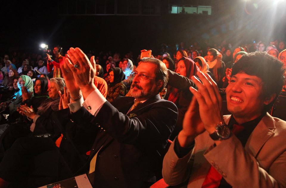 Members of the audience applause amid the performances of the various artists. Photo: Fardin Waezi / UNAMA