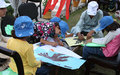 Afghan school children draw for International Peace Day